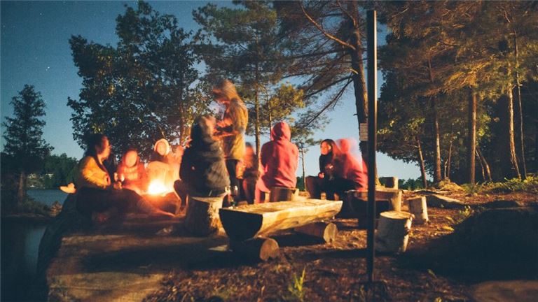 people around campfire