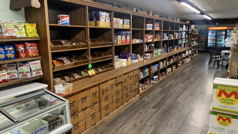 Antique Merchandise Shelving with Candy by the pound and Groceries