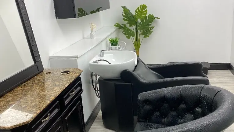 Salon suite room with shampoo bowl inside 