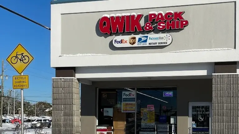 Front exterior of a well-branded QPS location with high foot-traffic exposure.