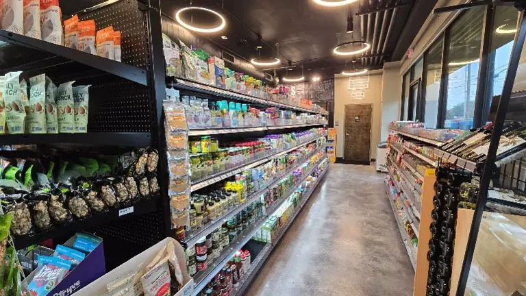 A spacious aisle with neatly arranged products, highlighting the store’s wide selection and organized shopping experience.