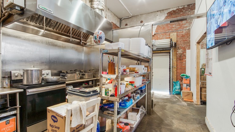 Partial view of kitchen where food is prepared.