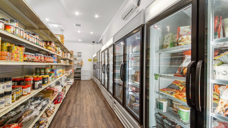 Wall of coolers and freezers.