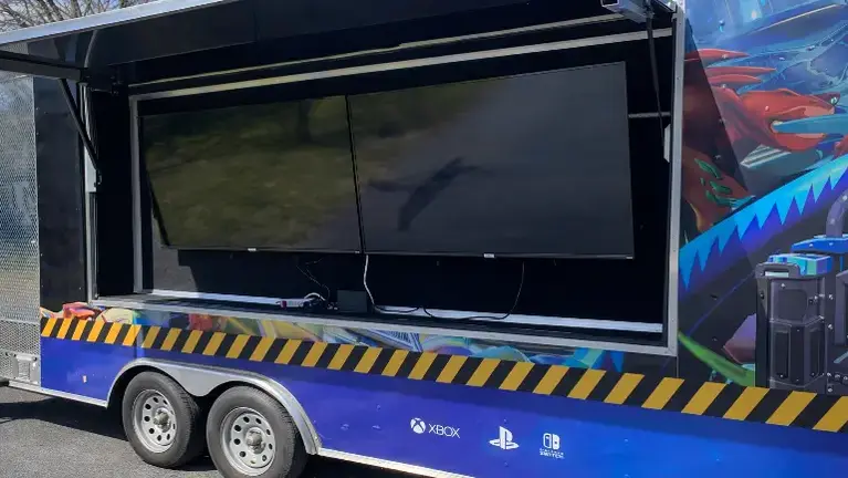 Mobile gaming trailer with TVs showcased