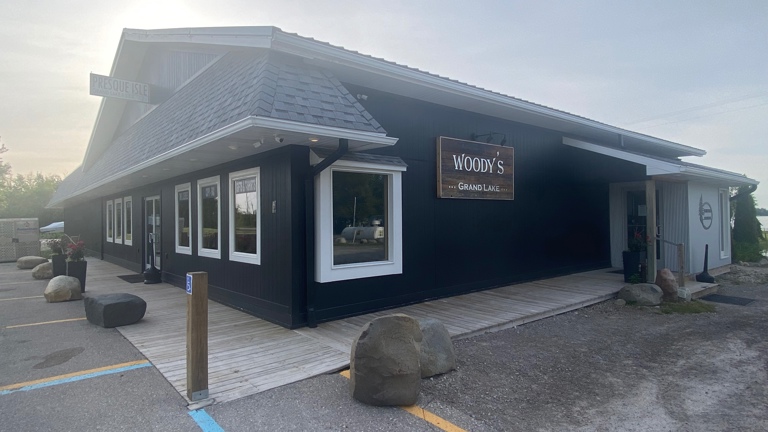 Front entrance to Sand Bay Trading Co and side entrance to Woody’s Grand Lake