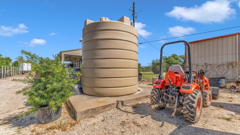 25000 gallon water tank for well and irrigation system where every tree has its own connection to the water