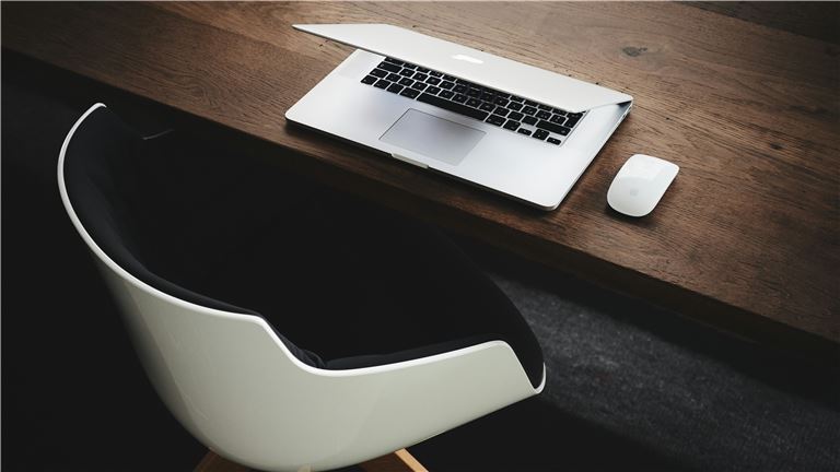 empty chair and laptop