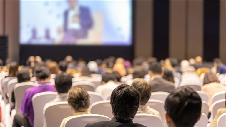 Business people listening to a presentation. Business people listening to a presentation.