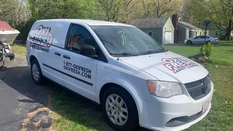 A 2015 Dodge Ram C/V Tradesman Mini Van with Oxi Fresh Logo Wrap