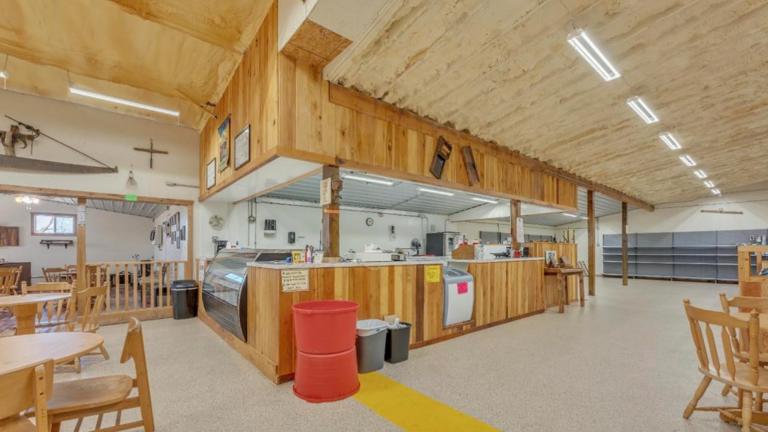 Interior store front also features a deli counter, food preparation area, including convection oven and sink, hand-scoop ice cream cooler & interior seating.