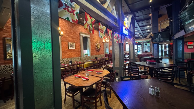 Indoor bar with recessed lighting and wood finished floors