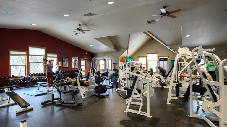 Weight room with free weights and machines
