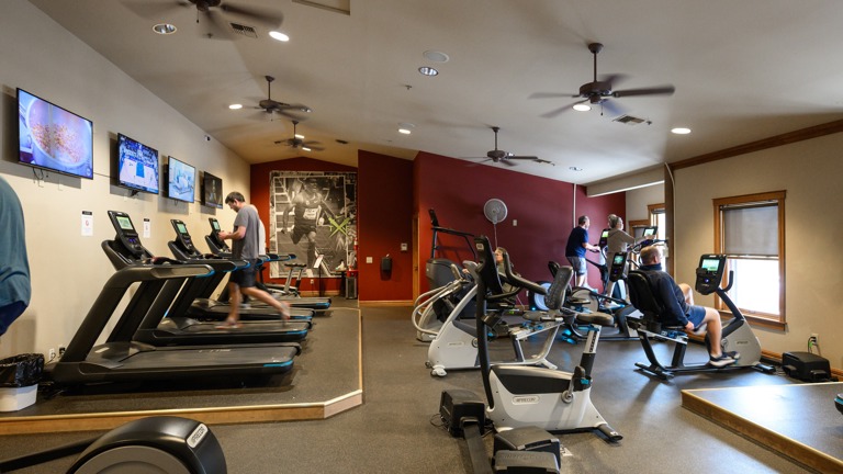 Cardio room with poster of Ashton Eaton