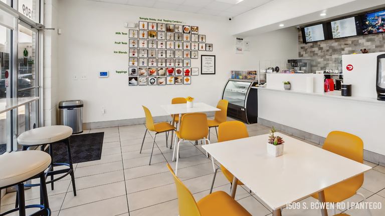 Bright, welcoming seating area with community photo wall and clean layout.