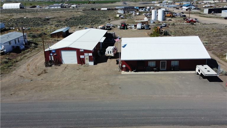 Two shop spaces for sale totally in 7k sq. ft. on one acre plus additional storage in Challis, ID.