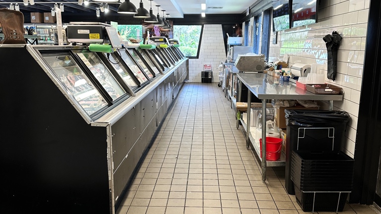 Behind the meat case