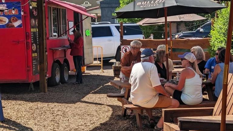Outdoor backyard with seating and enough room for food trucks