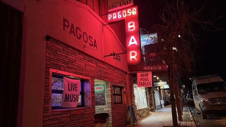 Exterior photo with iconic and historic Pagosa Bar neon sign