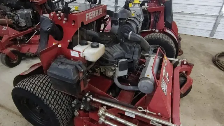 Has foot actuated grass flap to open and close grass chute on the fly