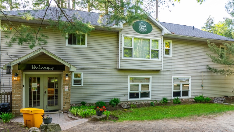 Main lodge with kitchen, dining room,walkout deck,lake views, games room