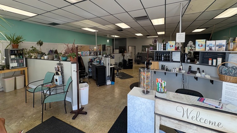 Open salon with hair, nail, and pedicure stations