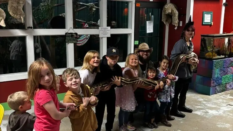 Kiddos meeting our 13ft reticulated python