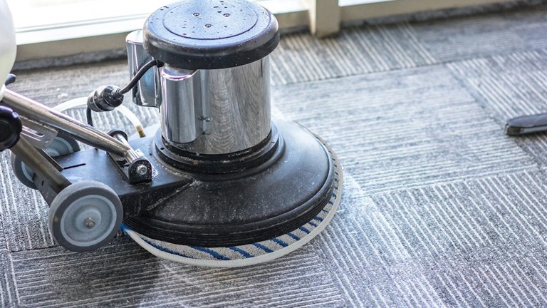 Low moisture bonnet carpet cleaning