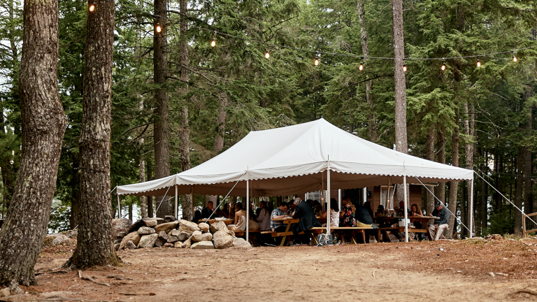 An event tent with 6 picnic tables accommodate large groups 