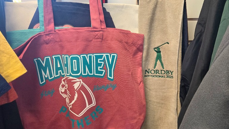 Bags and embroidered golf towels