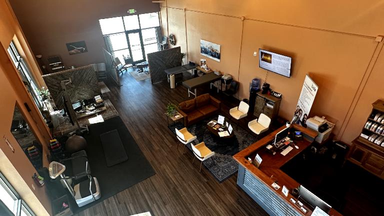 Full view of treatment bay with 3 chiropractic tables