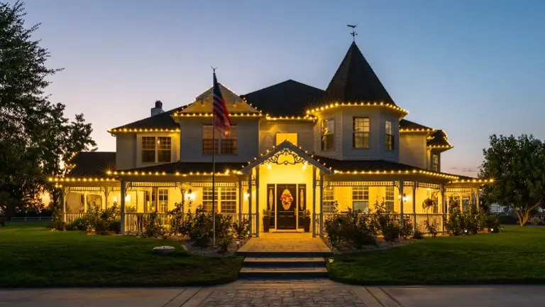 The 5,500 sq. ft. Victorian-inspired estate home, featuring 5 bedrooms, 6 baths, chef’s kitchen, library, and resort-style outdoor living with pool and spa. 