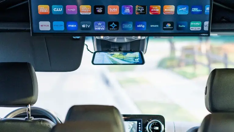 Mounted flat-screen smart TV (dashcam not included on van we're selling)