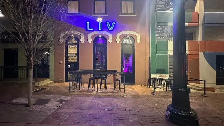 Downtown Houston storefront with illuminated LIV signage and strong street visibility in a high-traffic area.
