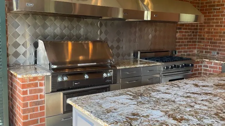 Comprehensive outdoor kitchen with grill, counters, and storage - multiple revenue opportunities