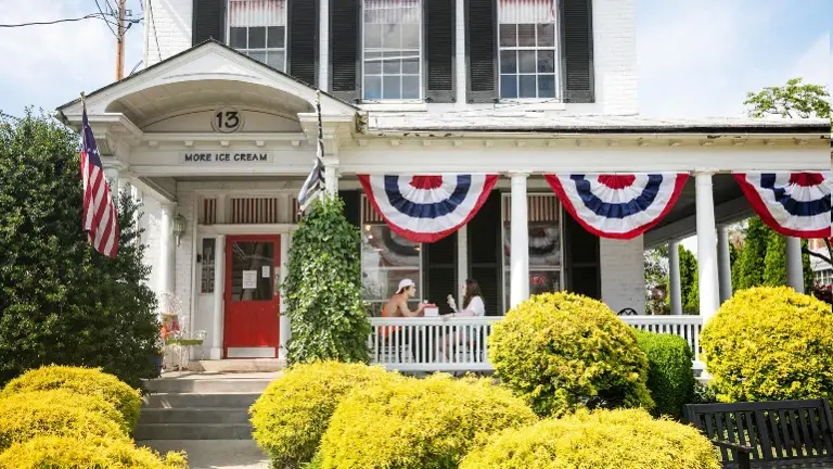 Iconic Main Street landmark with charming curb appeal, bold signage, and patriotic small-town character. Iconic Main Street landmark with charming curb appeal, bold signage, and patriotic small-town character.