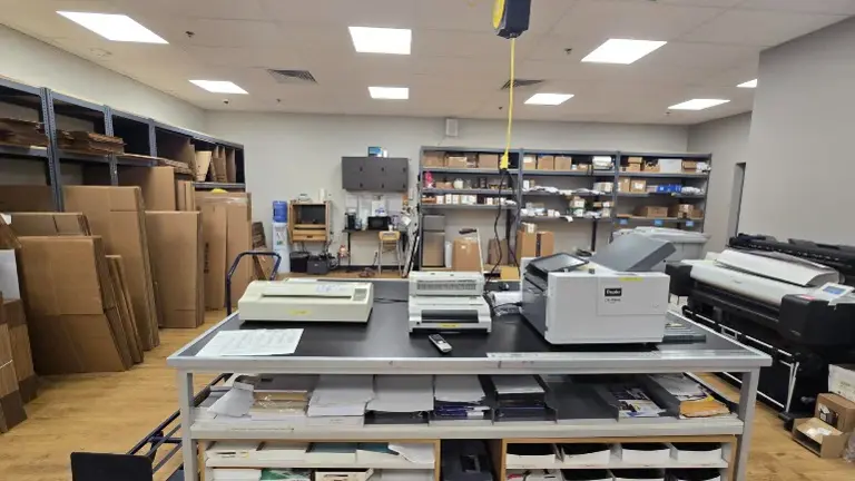 Large back room with premium print equipment, tables, and storage. Large back room with premium print equipment, tables, and storage.