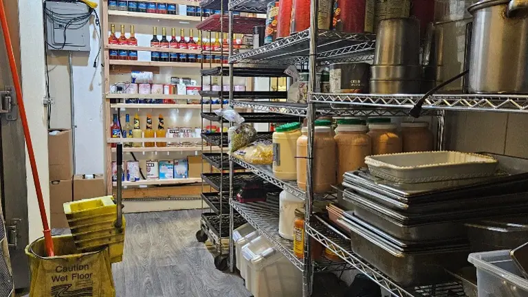 Back storage room with huge walk-in cooler and freezer Back storage room with huge walk-in cooler and freezer