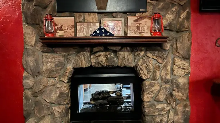 Fireplace separates lounge and dining areas