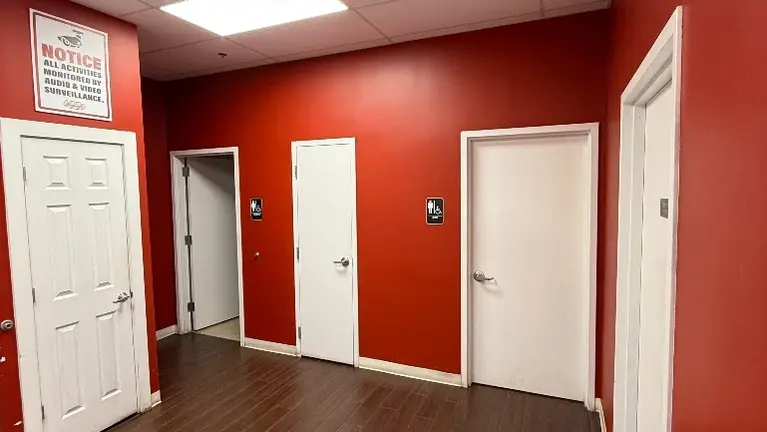 Back Area. 2 Bathrooms, Storage Closet & Mop Closet