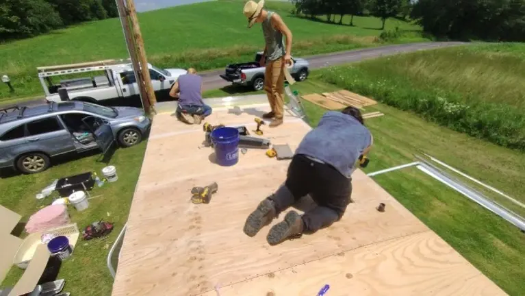 Subcontractor crew replacing a roof
