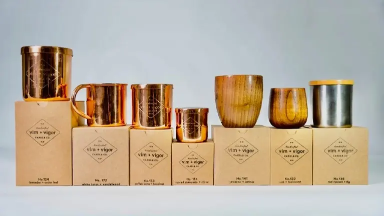Copper, wood and stainless steel candles in eco friendly packaging