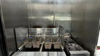 Restaurant with Hood next to Movie Theater