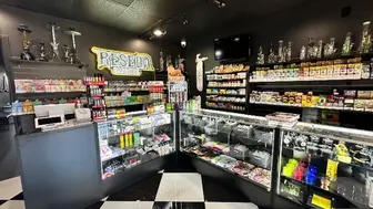 Smoke shop with speakeasy barbershop