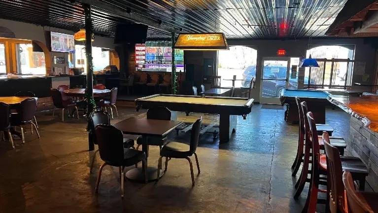 Spacious tavern area featuring pool tables and games that increase customer dwell time and beverage sales. Spacious tavern area featuring pool tables and games that increase customer dwell time and beverage sales.