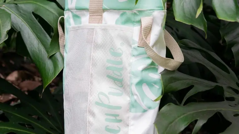 The Bucket Bag doubles as a backpack to hold your Beach Puddle and fill your puddle with water