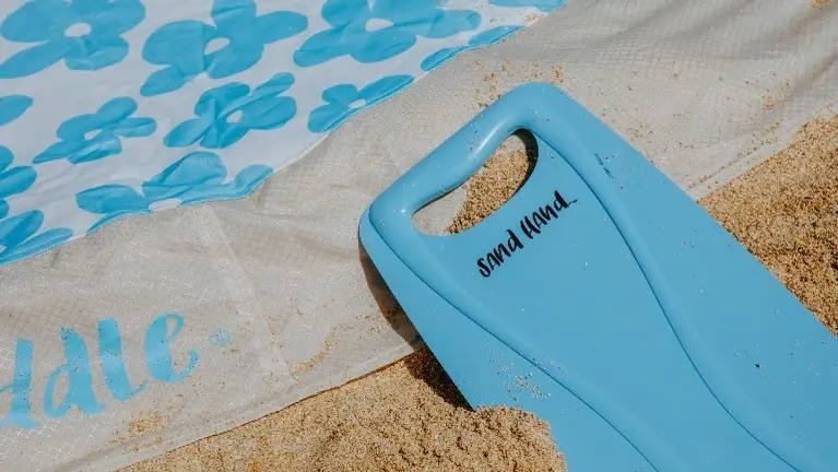 The patented Sand Had helps dig the puddle hole quickly