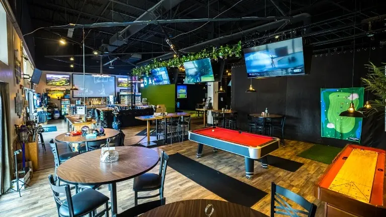 Open lounge and entertainment area with billiards, shuffleboard, mounted TVs, and table seating — designed for groups, walk-ins, and event hosting. Open lounge and entertainment area with billiards, shuffleboard, mounted TVs, and table seating — designed for groups, walk-ins, and event hosting.