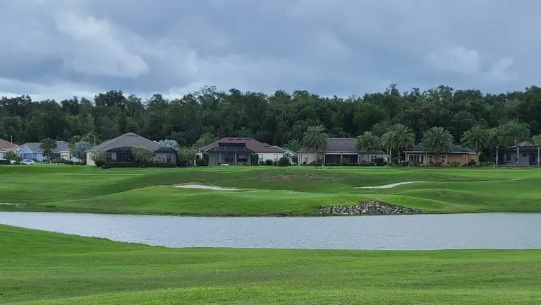 Beautiful covered lanai overlooking one of three nine hole professional golf courses! Beautiful covered lanai overlooking one of three nine hole professional golf courses!