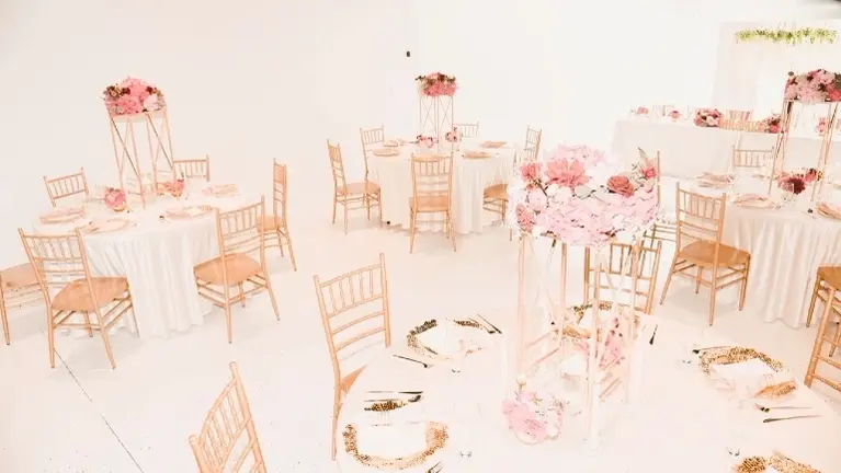 Example table setup with included Chiavari chairs and décor potential.