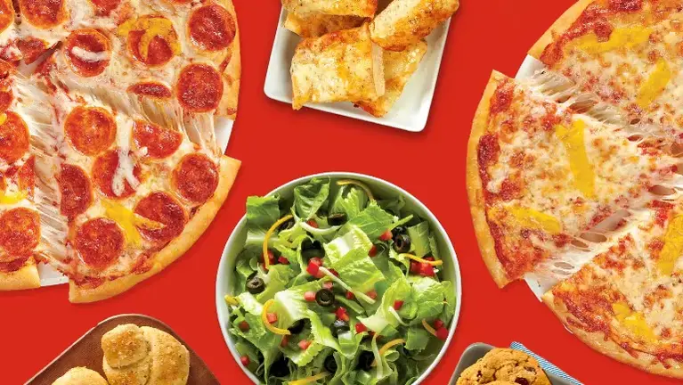 Fresh Take 'N' Bake pizza — scratch-made dough, hand-sliced veggies, freshly grated mozzarella daily.